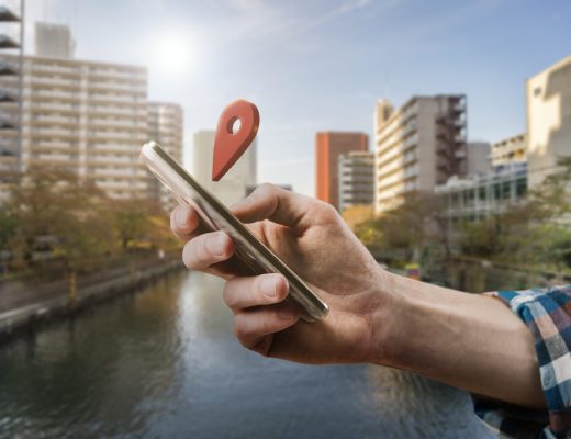 side-view-hand-holding-smartphone